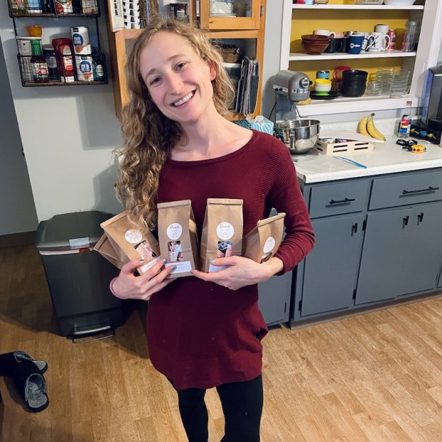 Girl holding bags of peppermint bark