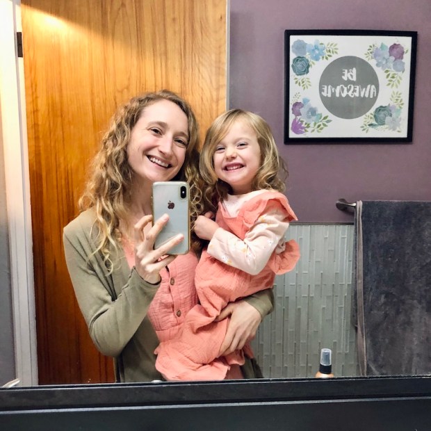 Mom and daughter wearing matching dresses