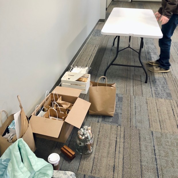 Setting up table for holiday market