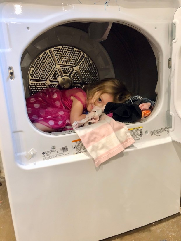 Toddler girl in the dryer