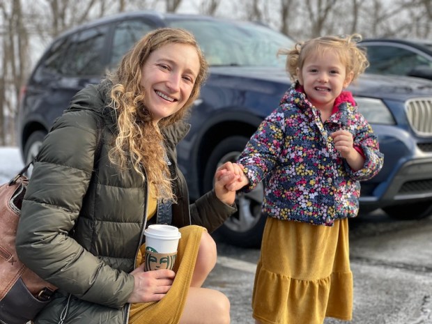 Mom and daughter wearing matching gold dresses