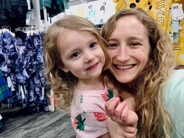 Mom and daughter selfie in clothing section of Target