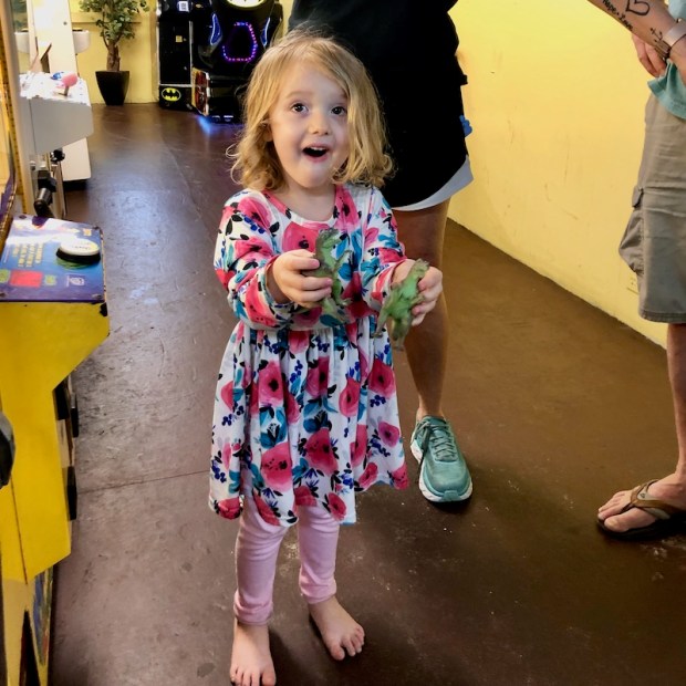 Toddler girl at Avalon Fishing Pier arcade in Kill Devil Hills, NC