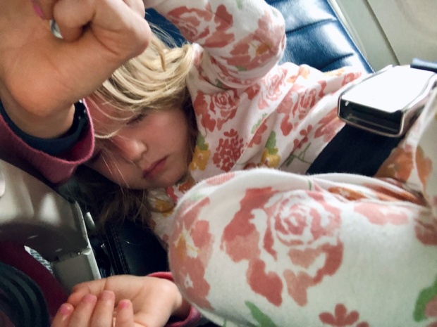 Toddler sleeping on airplane