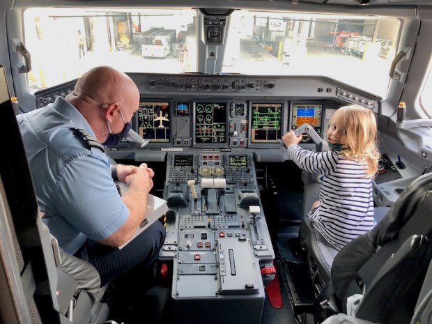 Toddler in cockpit of plane