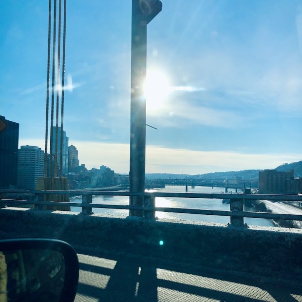 Sunshine over river on Fort Pitt Bridge in Pittsburgh, PA