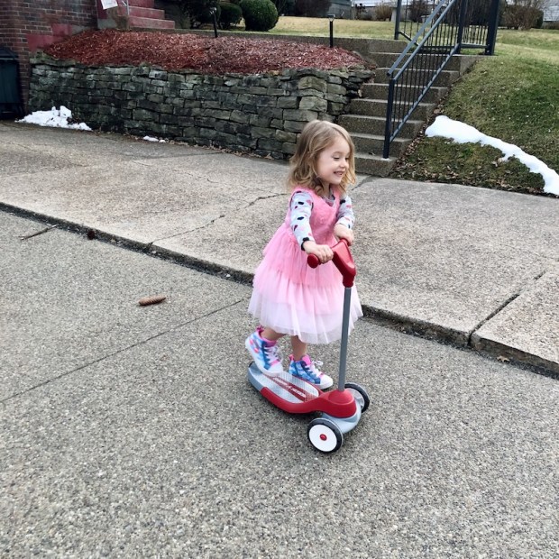 Toddler riding a Radio Flyer scooter