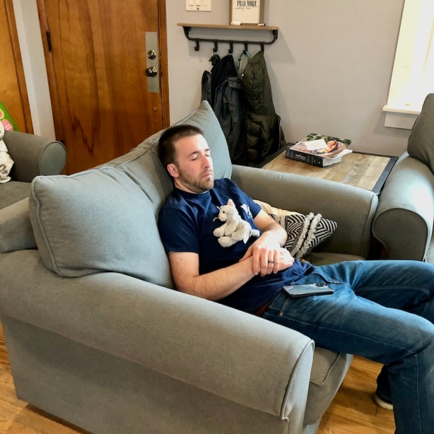 Guy sleeping with stuffed animal