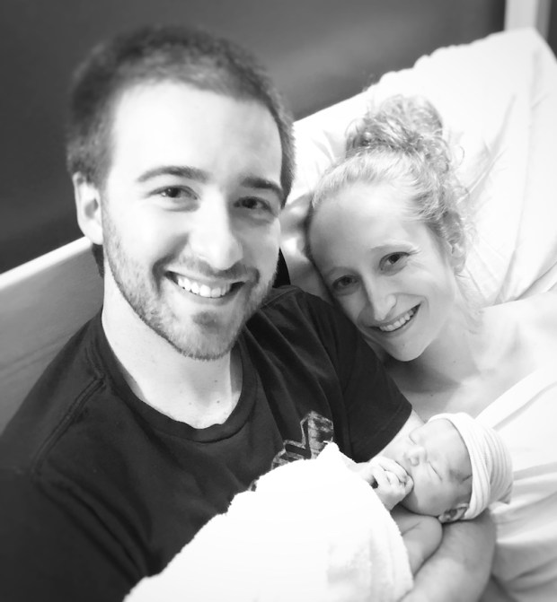 Dad and mom with newborn baby
