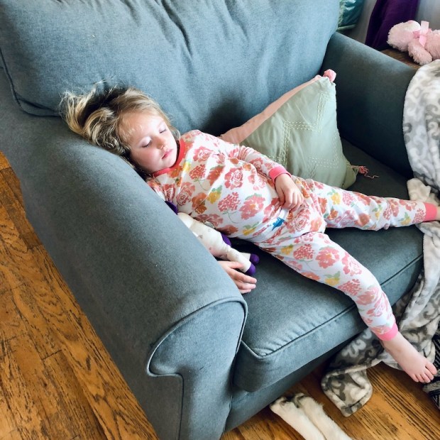 Toddler asleep on couch with fever