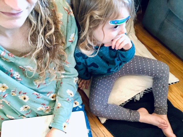 Mom and daughter sitting on the ground