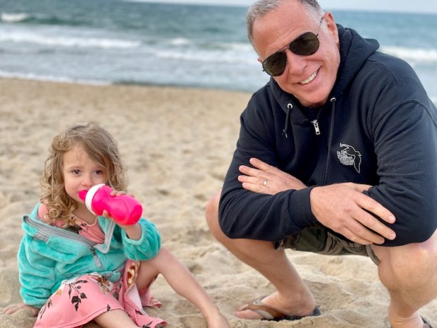 Grandpa with toddler on the beach in Outer Banks, NC