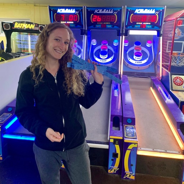 Girl playing in arcade on Avalon Fishing Pier in Kill Devil Hills, NC