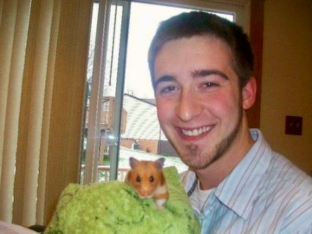 Guy holding hamster