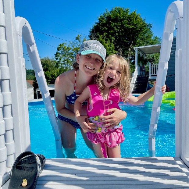 Mom and daughter swimming