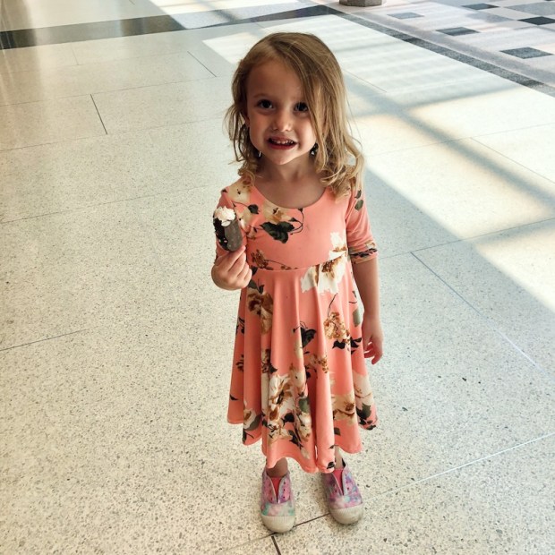 Girl inside mall with chocolate covered marshmallows