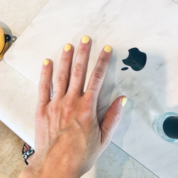 Nails painted yellow