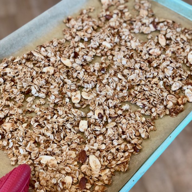 Coconut almond granola on a baking sheet