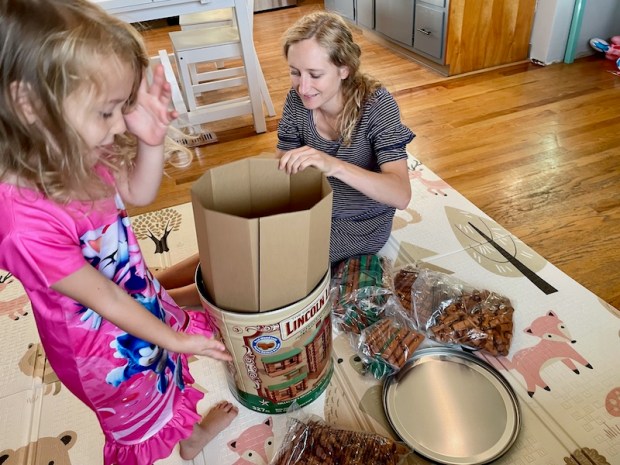 Mom and daughter playing with Lincoln Logs