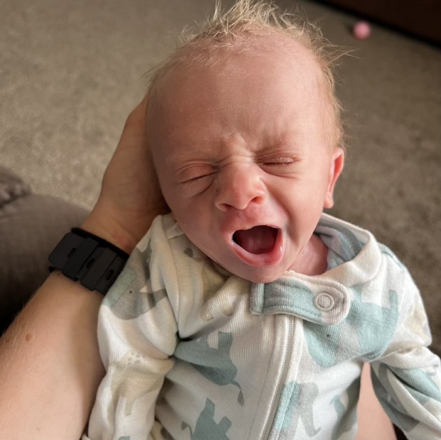 Four pound newborn baby yawning