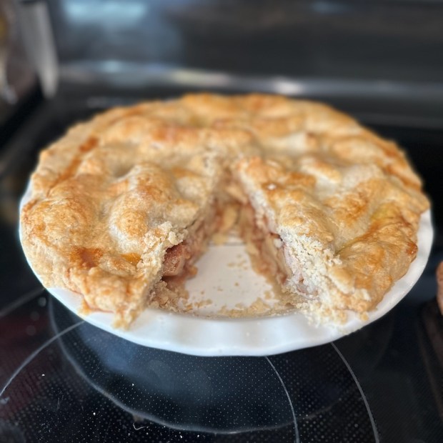 Apple pie with slice out of it