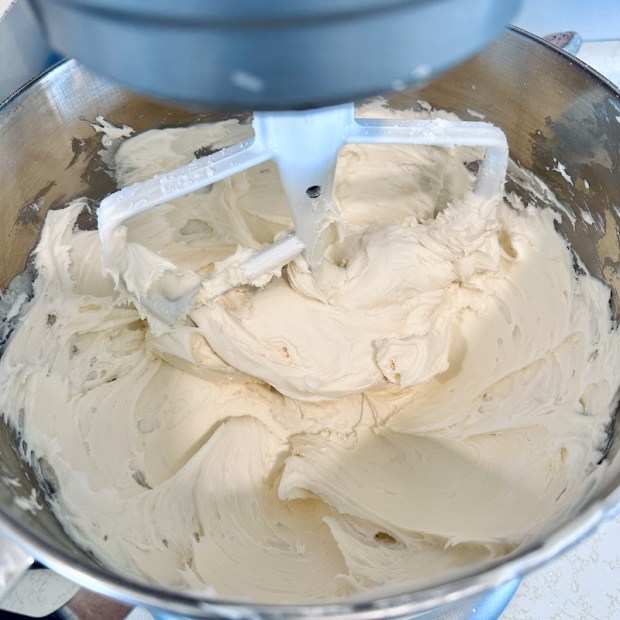 Vanilla buttercream frosting in mixing bowl