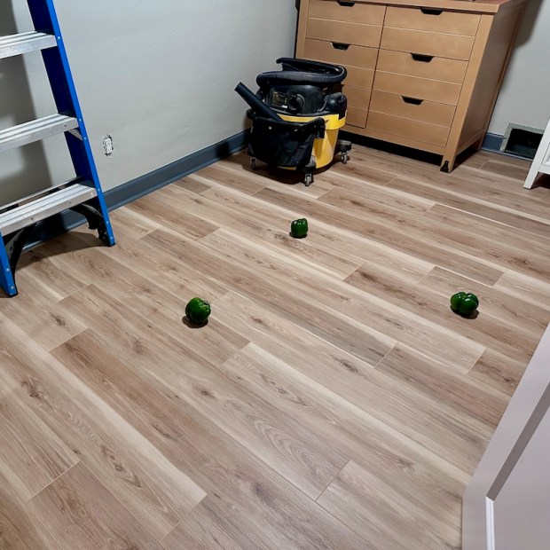 Green peppers on floor