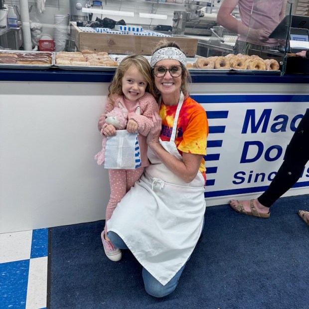 Girl at Madsen Donuts with worker