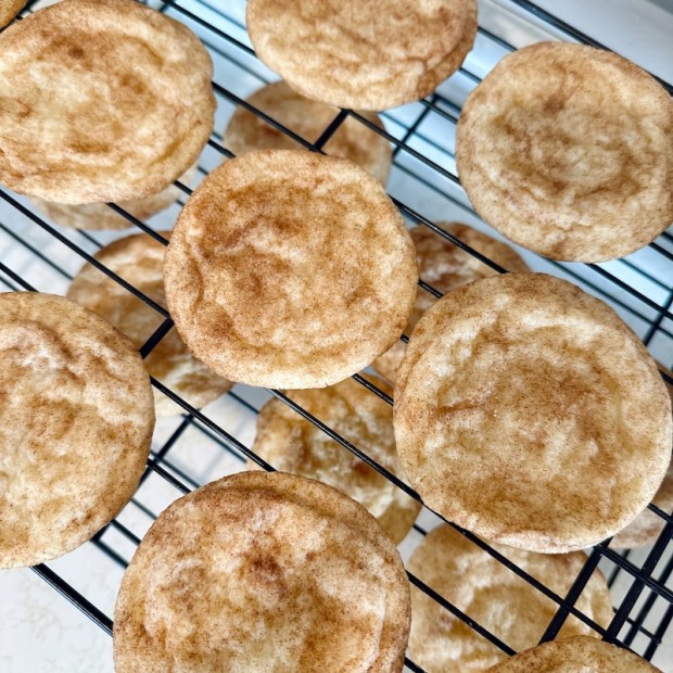Snickerdoodle cookies on baking rack