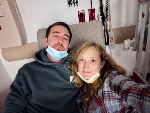 Husband and wife sitting in recliner in emergency room at Children's Hospital of Pittsburgh