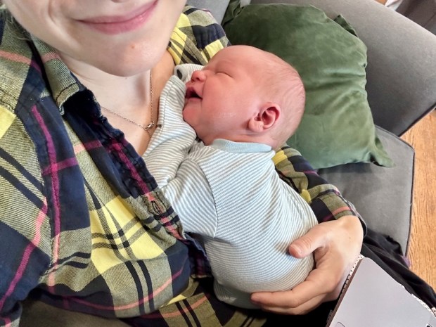 Baby boy smiling in his sleep