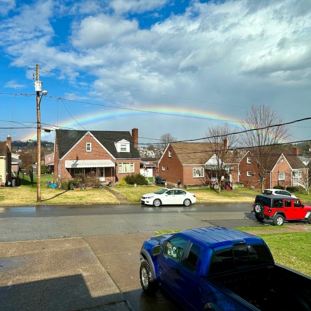 Full rainbow over houses in Pittsburgh