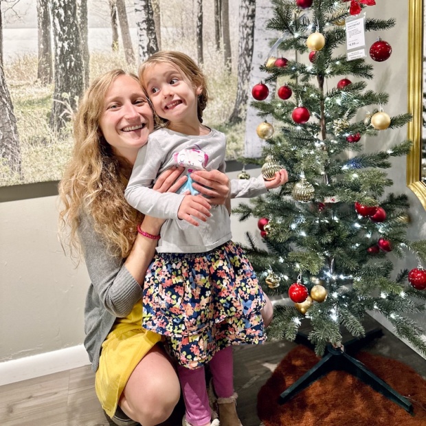 Mom and daughter near Christmas tree at Ikea