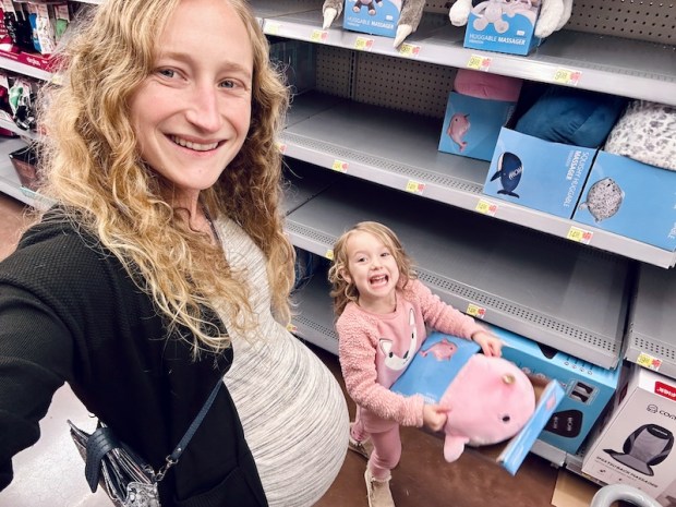 Pregnant mom and daughter in Walmart