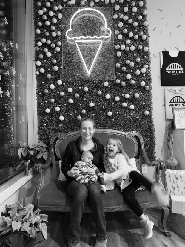 Mom sitting with kids on a bench at Millie's Homemade Ice Cream in Pittsburgh, PA