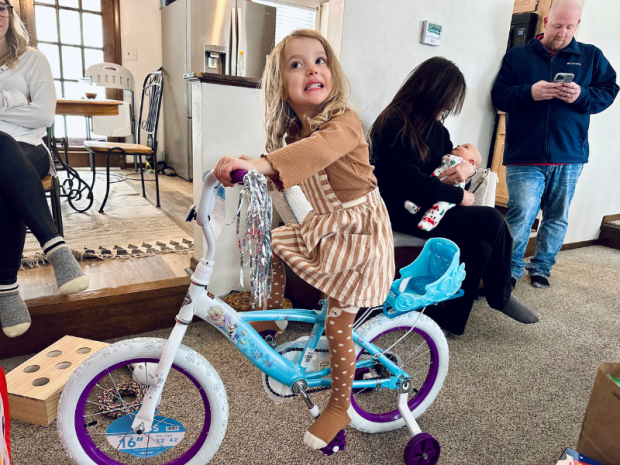 Four year old on Frozen bike with training wheels