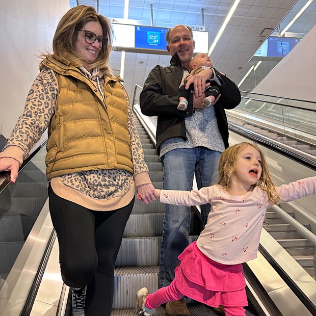Grandparents on escalator with grandkids at Pittsburgh RV Show