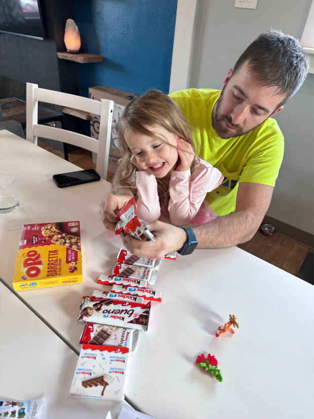 Dad and daughter with Kinder chocolate from Italy