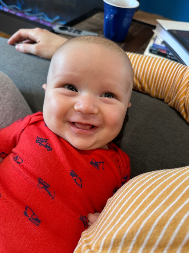 Two month old baby boy smiling