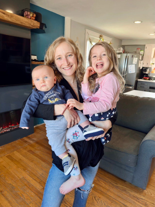 Mom holding baby boy and daughter