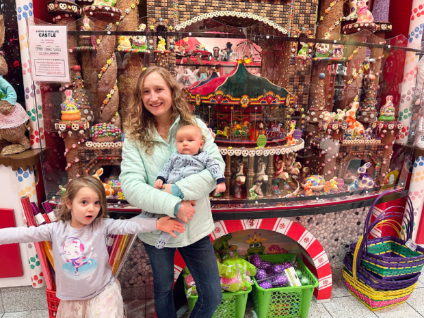 Mom and kids in front of chocolate display at Sarris Candies