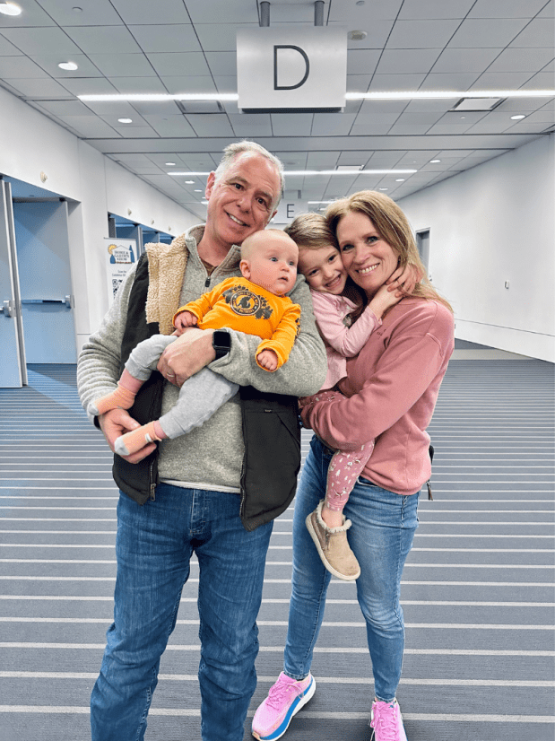 Grandparents holding grandson and granddaughter