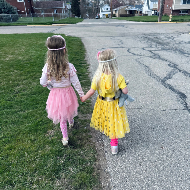Two toddler girls walking