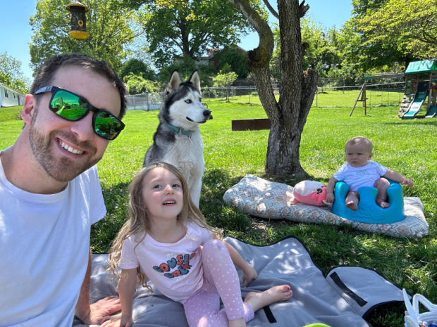 Dad outside with kids and husky