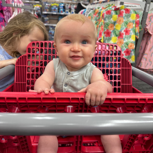 Baby boy in shopping cart