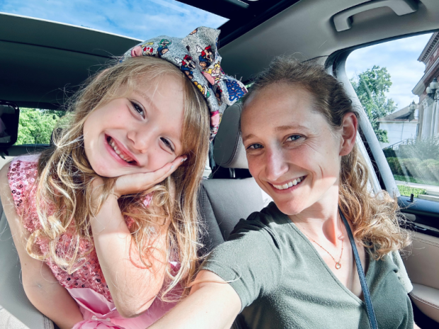 Mom and daughter with daughter wearing Super Mario headband