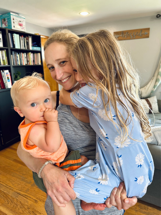 Mom holding baby and four year old