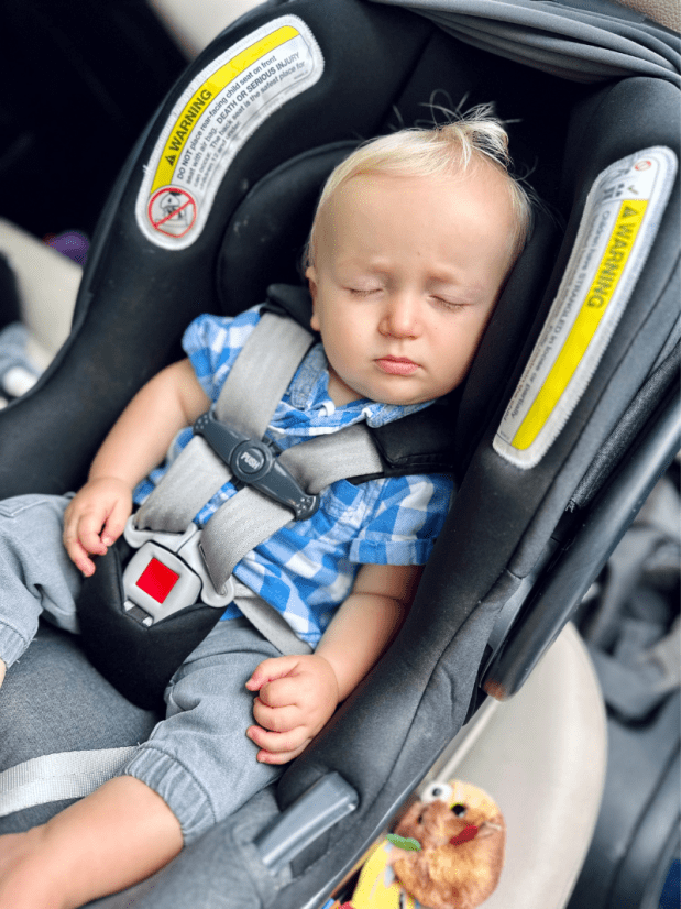 Baby boy sleeping in carseat