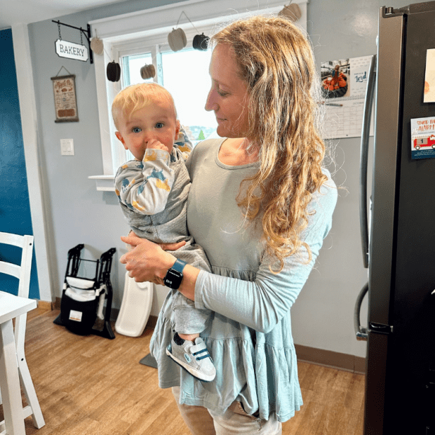 Mom holding 11 month old baby boy