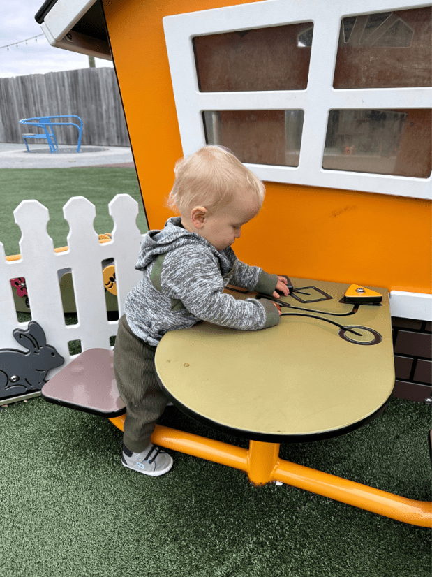 Baby boy playing at playground at Ark Encounter